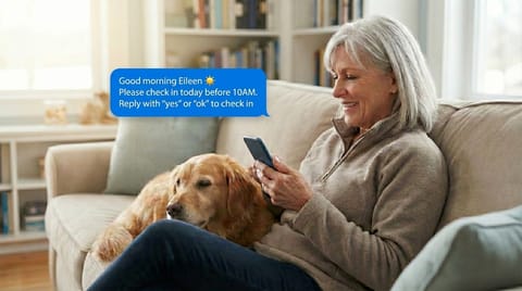 Senior woman smiling while using CheckRise daily check-in service on her phone